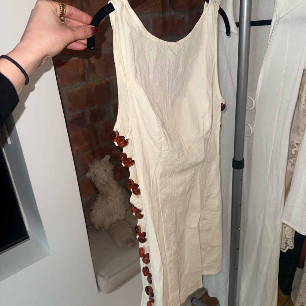 Cream Sleeveless Dress with Tortoiseshell Side Buttons